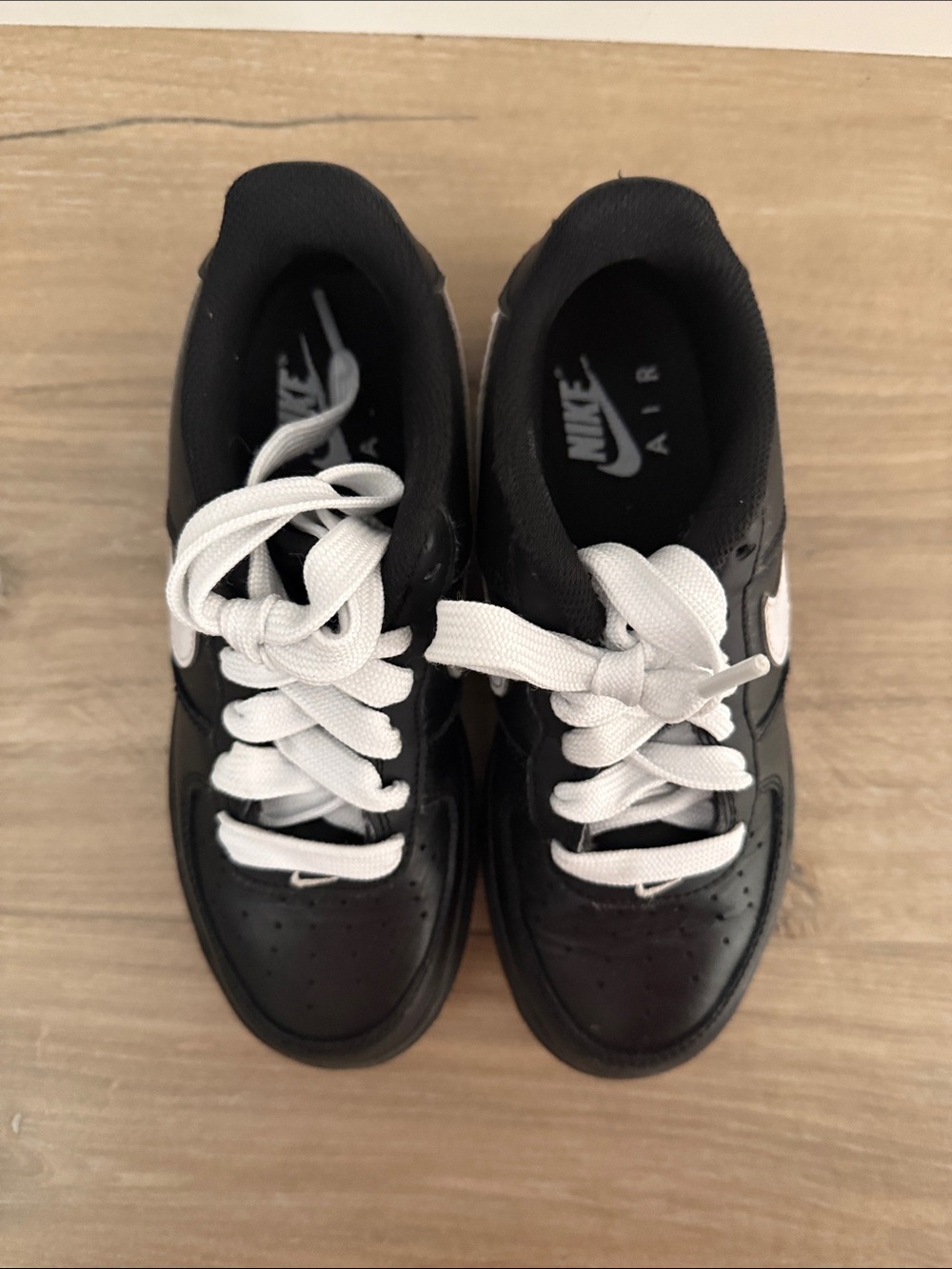 Nike Air Force1 Kids Black Leather Low-Top Sneakers with White Swoosh - Picture 5 of 6